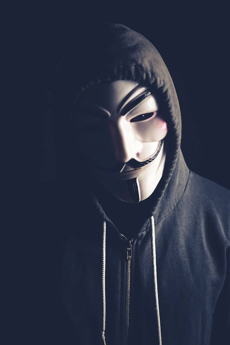 masked man with hooded sweatshirt