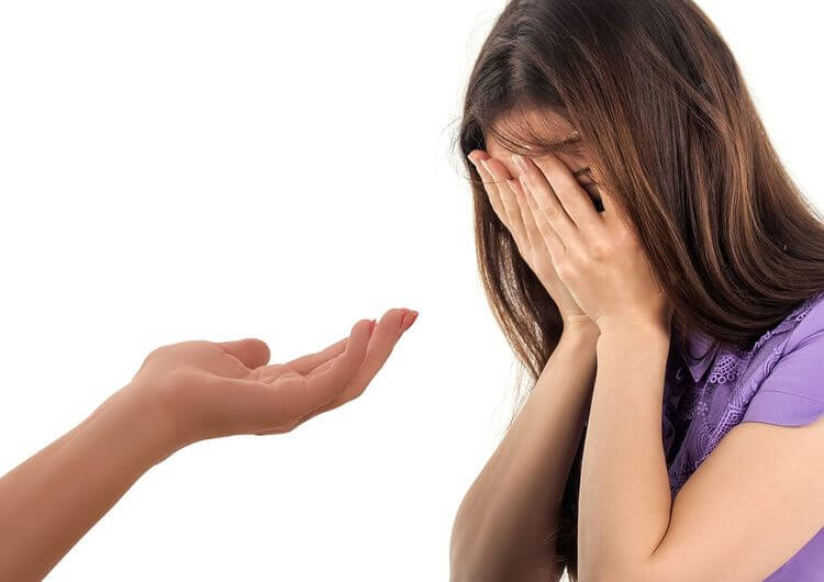 girl crying with helping hand