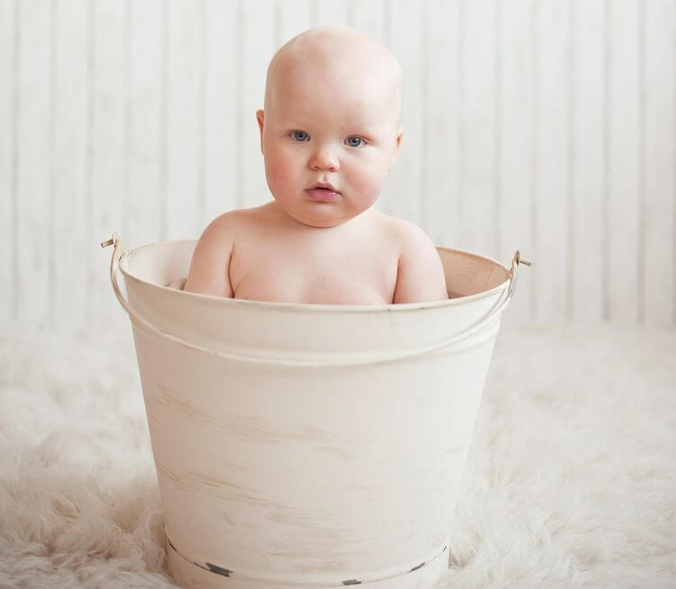 baby in a bucket