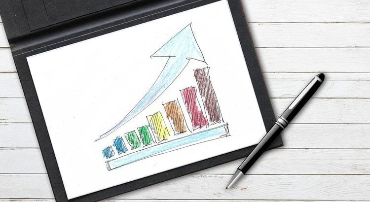 notebook with trend chart pointing upward